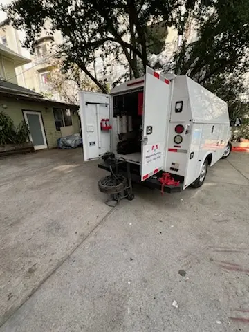 Magnet Plumbing service vehicle on-site for Grease Trap Cleaning in Banana River Estates